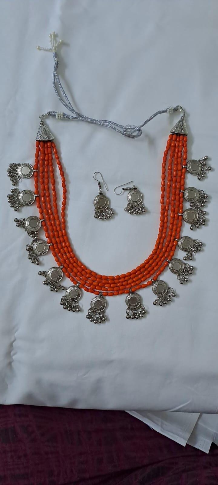 Exclusive multi layered  orange glass beads necklace set with silver oxidised charms n matching earrings