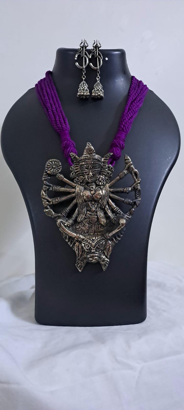 purple thread necklace with oxidised golden durga pendant