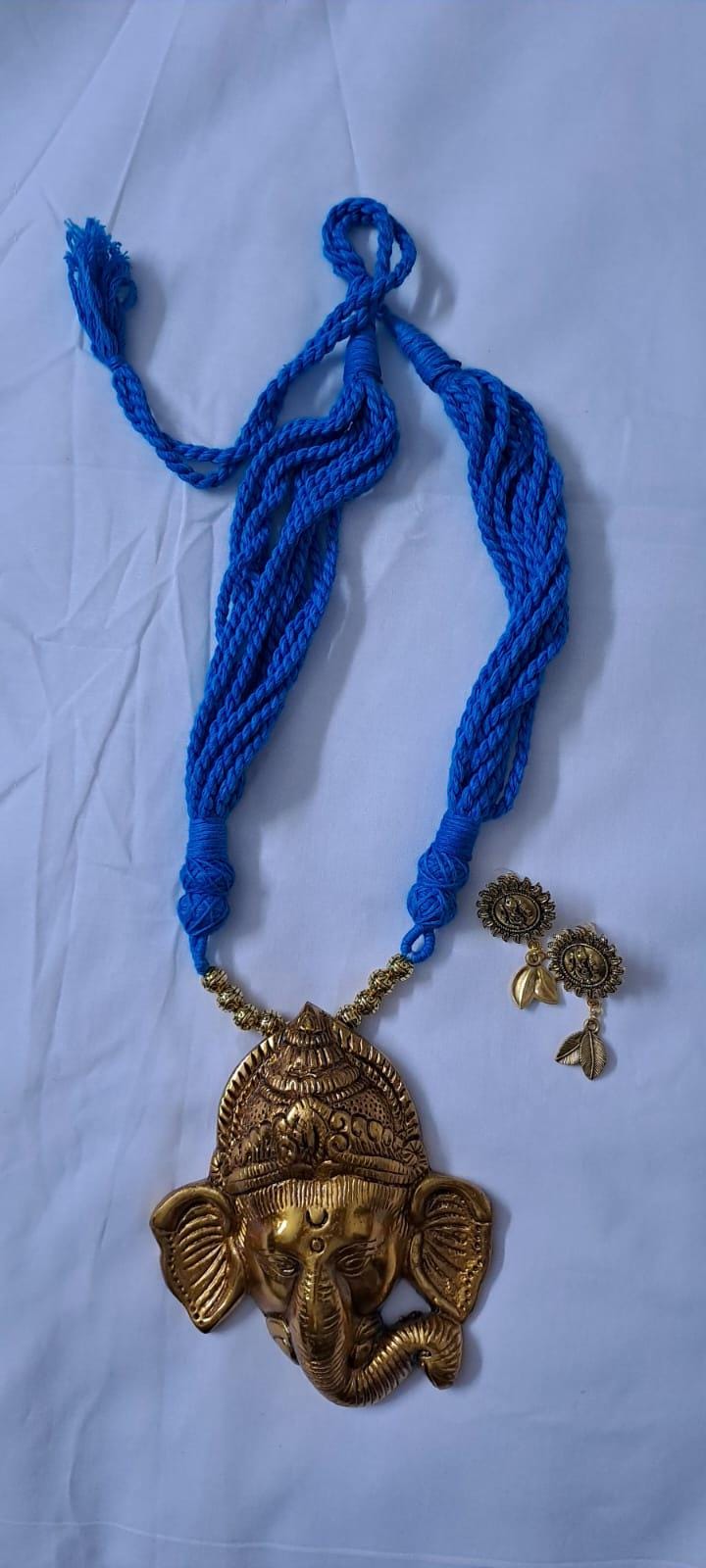 Blue thread necklace with golden oxidised ganesha pendant