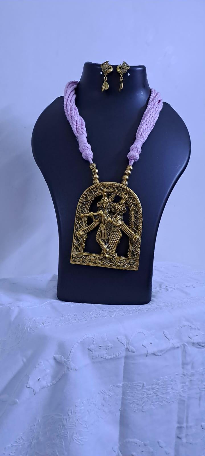 Radha Krishna golden oxidised pendant necklace in pink tread with matching earrings