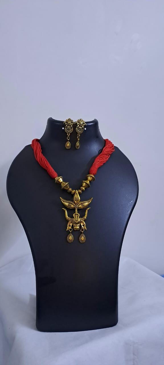 Red thread necklace with golden oxidised pendant