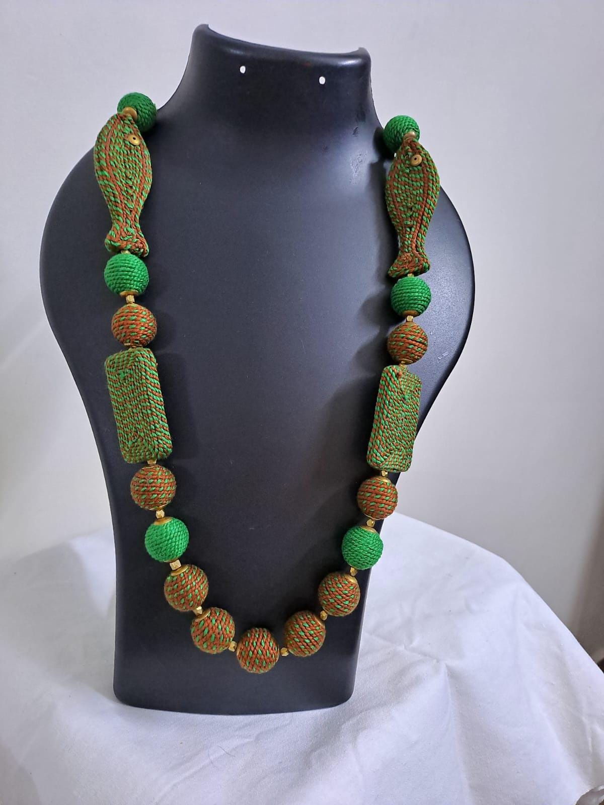 Exclusive brown n green thread necklace with fish shape thread beads and matching earrings.