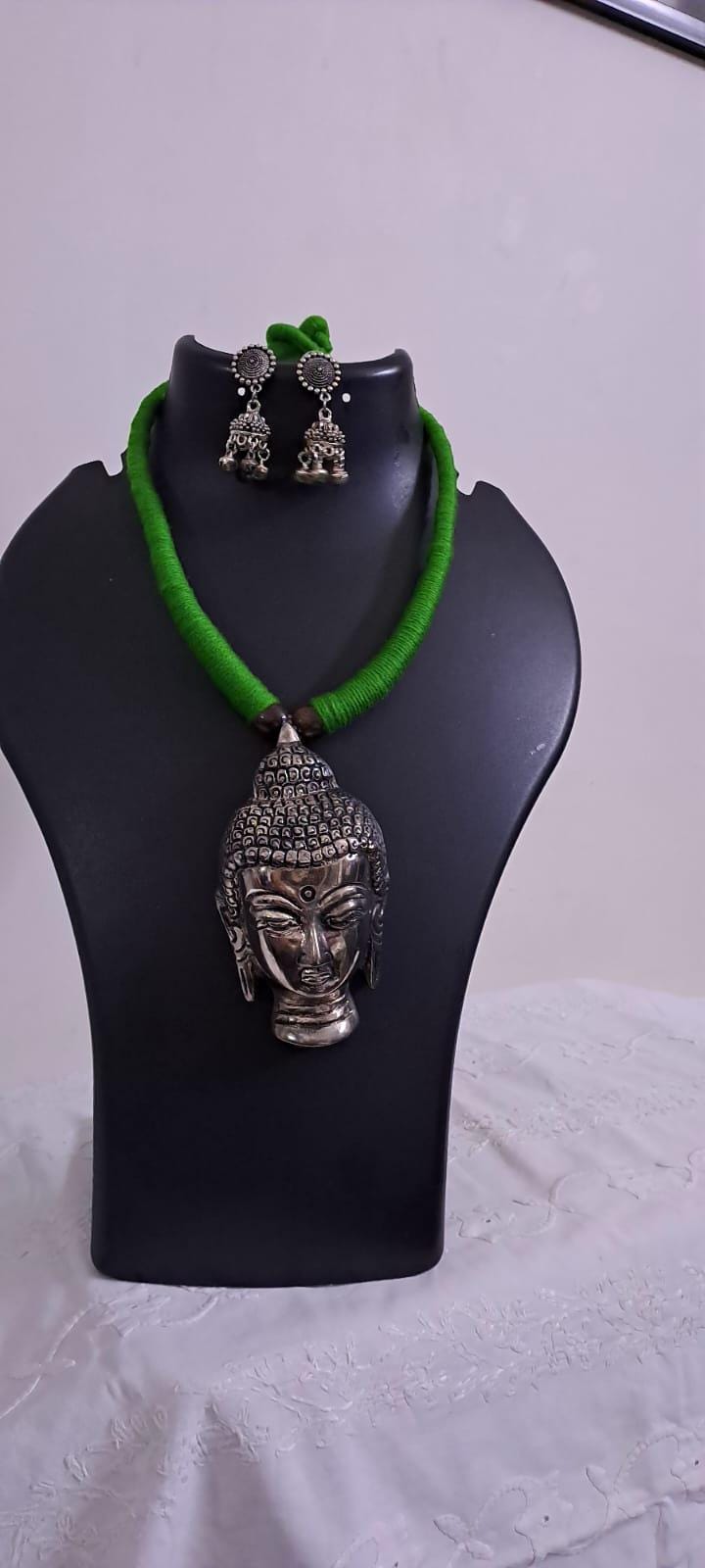 Green thread necklace with silver oxidised buddha pendant
