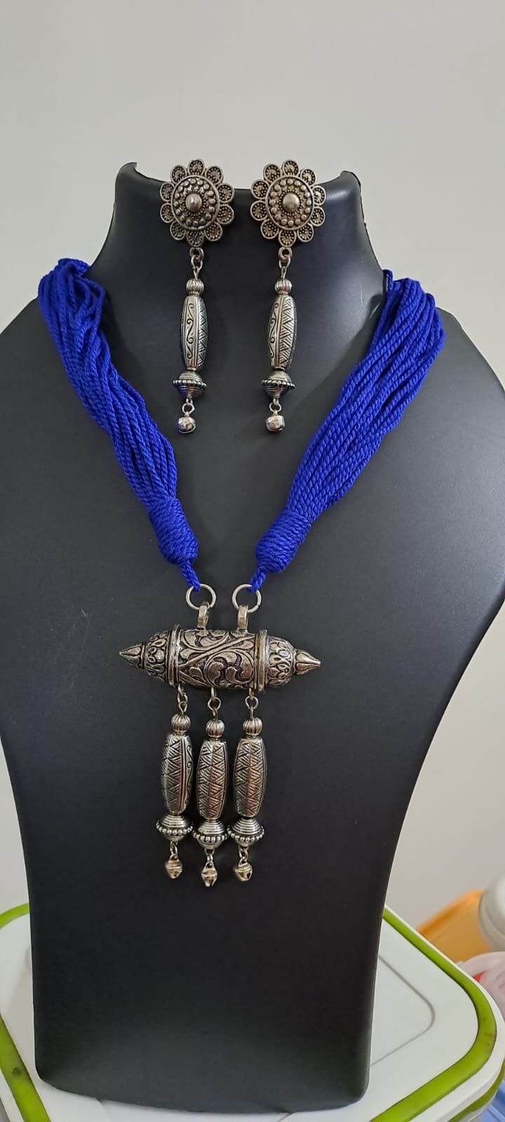 Blue thread necklace with silver oxidised traditional pendant