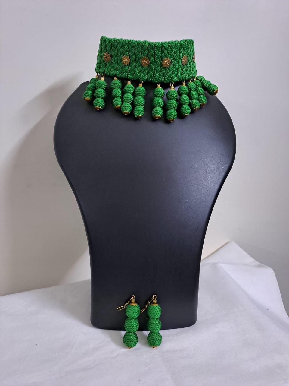 Green braided choker necklace set with fringes and matching earrings