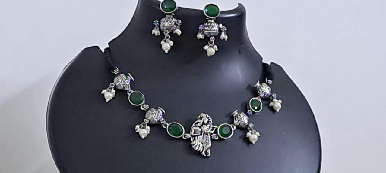 Exclusive silver oxidised lstone necklace with radha krishna pendant with matching earrings