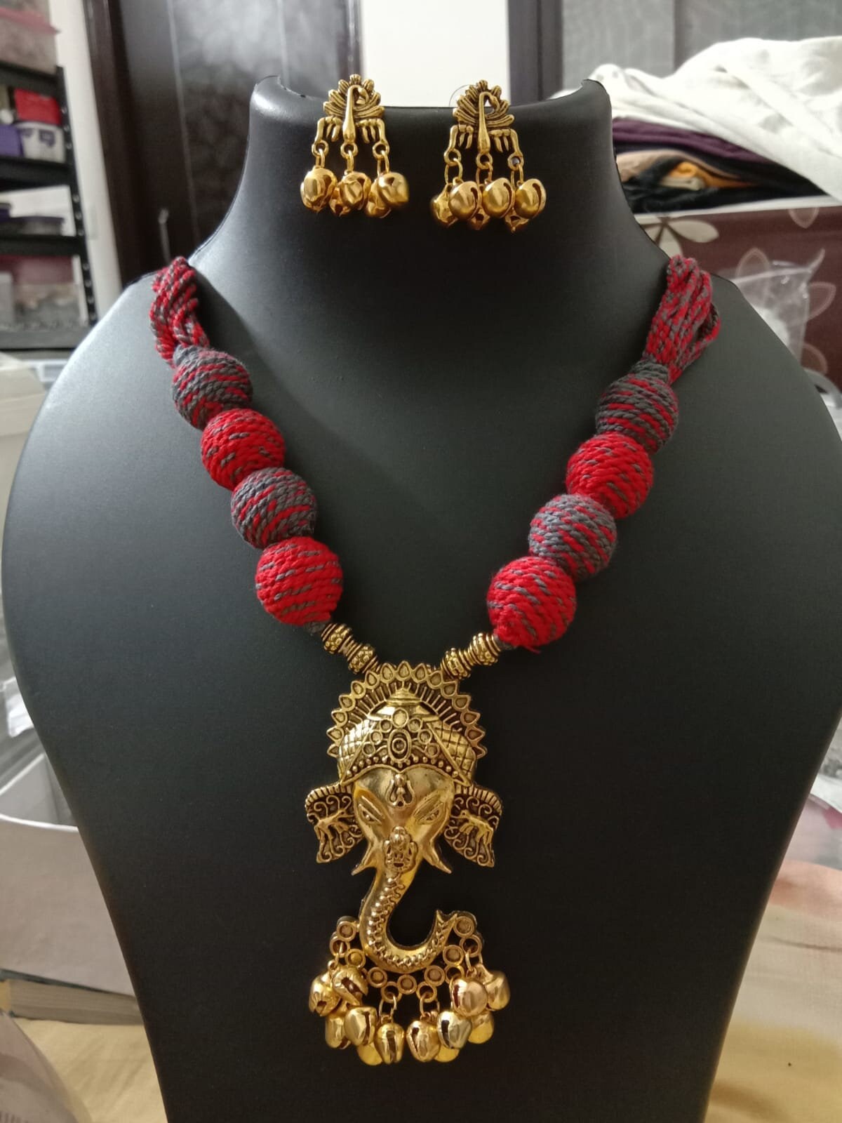 Oxidised golden ganesha traditional pendant and matching earrings.