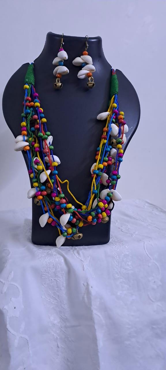Exclusive multi-coloured and multi-layered thread necklace with shells, wooden beads n trinkets.