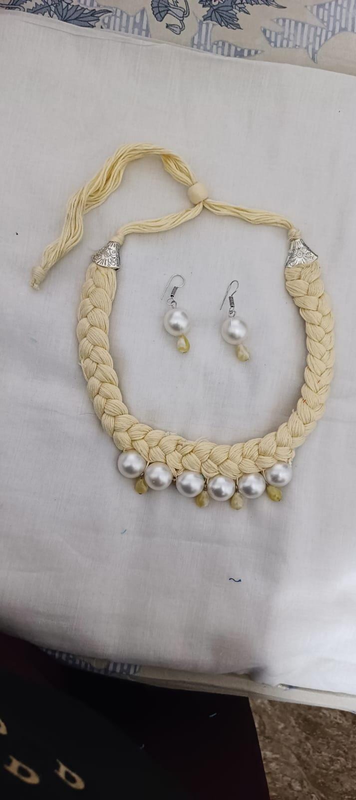 Offwhite braided thread necklace with pearl n pearl danglers