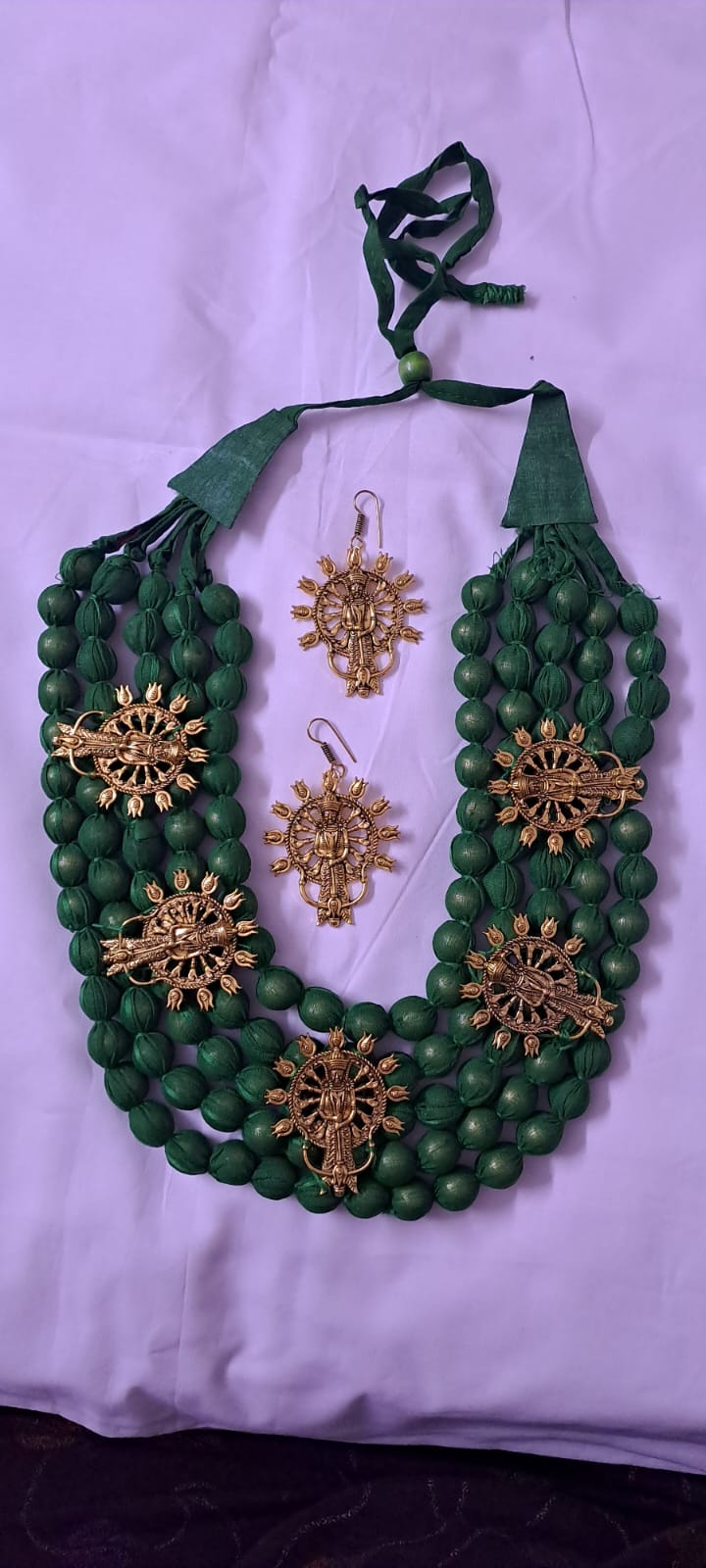 Multilayered fabric beads set with golden oxidised goddess Durga pendants - Green