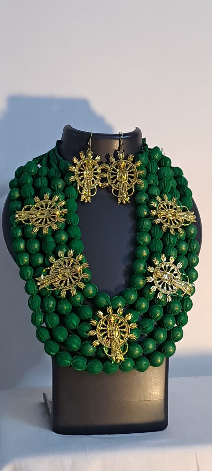 Multilayered fabric beads set with golden oxidised goddess Durga pendants - Green