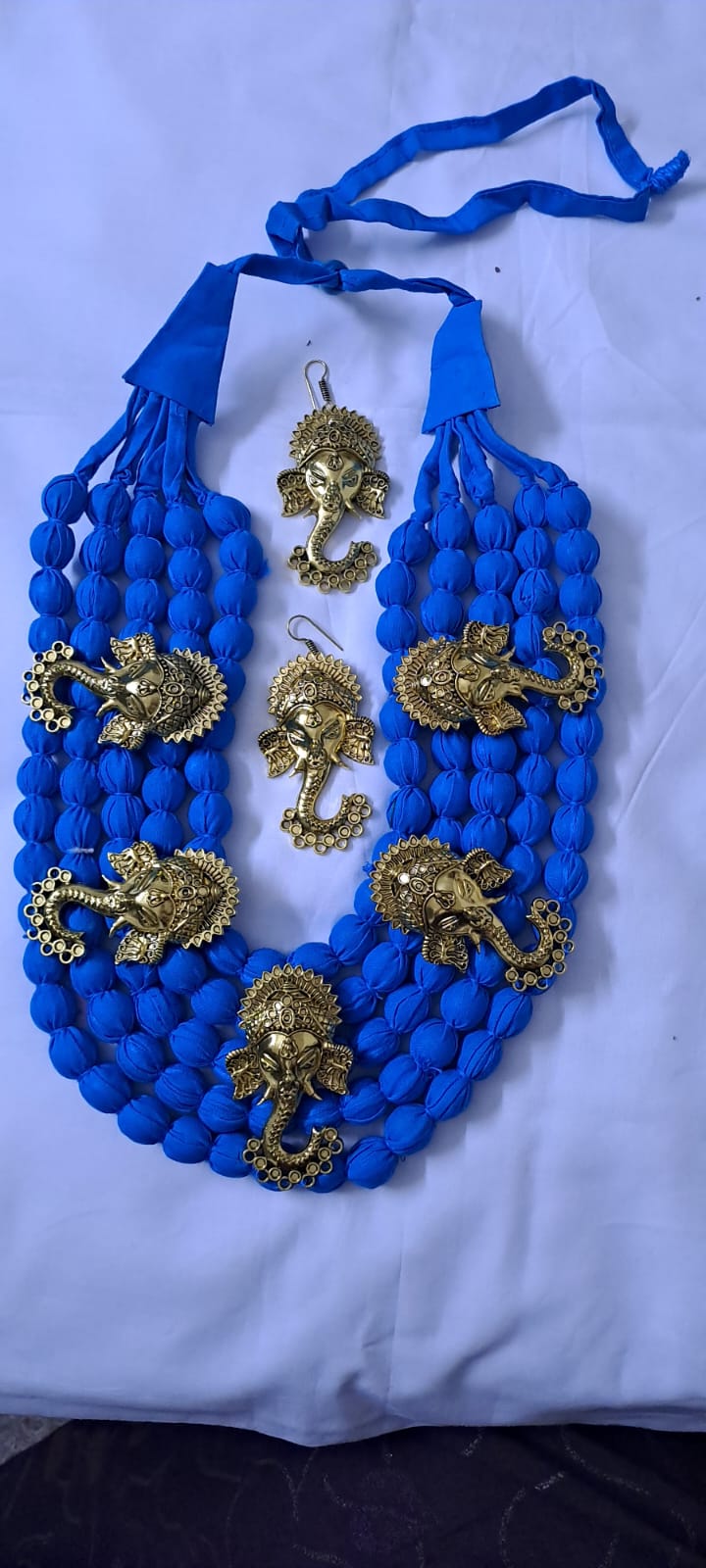 Multilayered fabric beads set with golden oxidised goddess Durga pendants - Blue