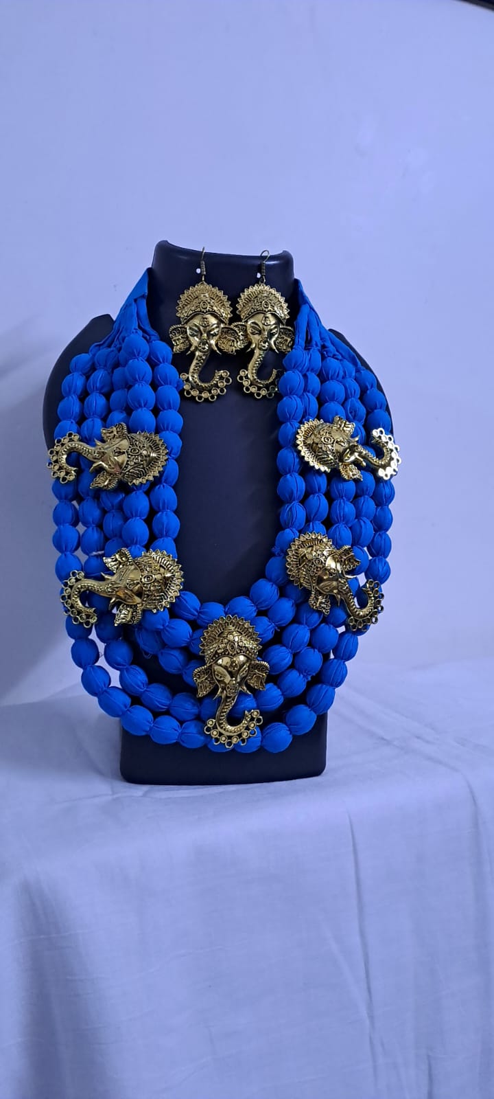 Multilayered fabric beads set with golden oxidised goddess Durga pendants - Blue