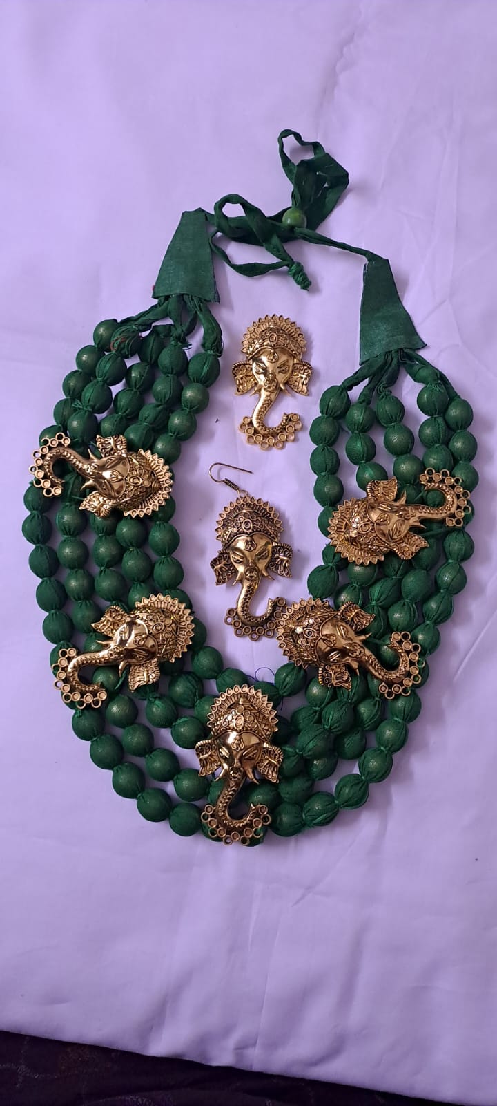 Multilayered fabric beads set with golden oxidised goddess Durga pendants - Dark Green