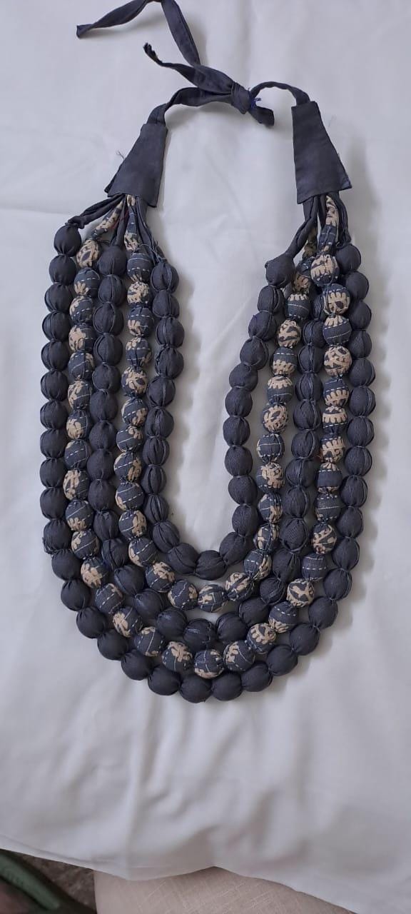 Exclusive multi-layered light grey fabric necklace