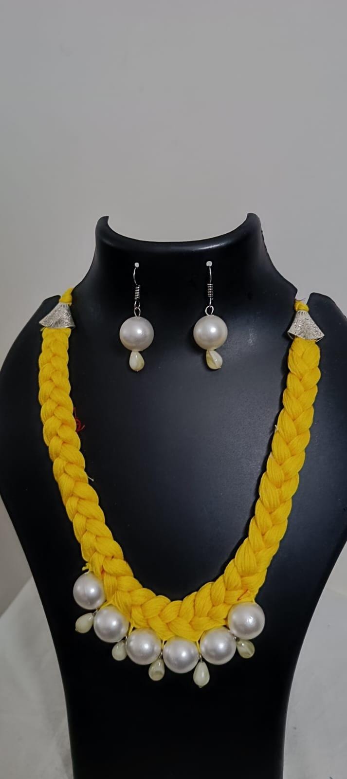 Yellow  braided thread necklace with pearl n pearl danglers