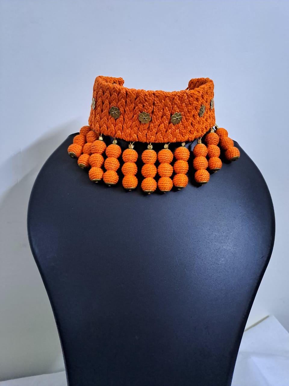 Orange braided choker necklace set with fringes and matching earrings