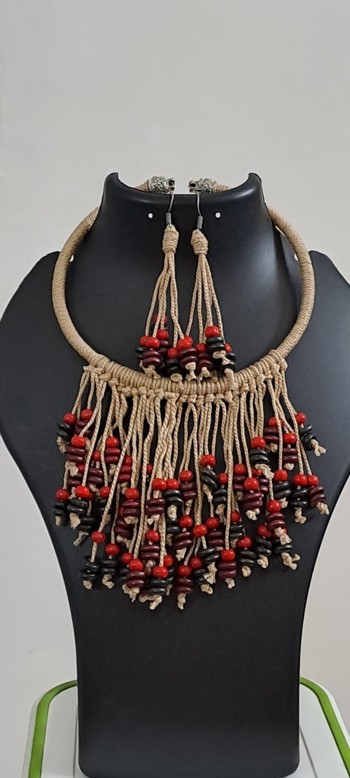 Exclusive beige thread neckband with fringes and matching earrings.