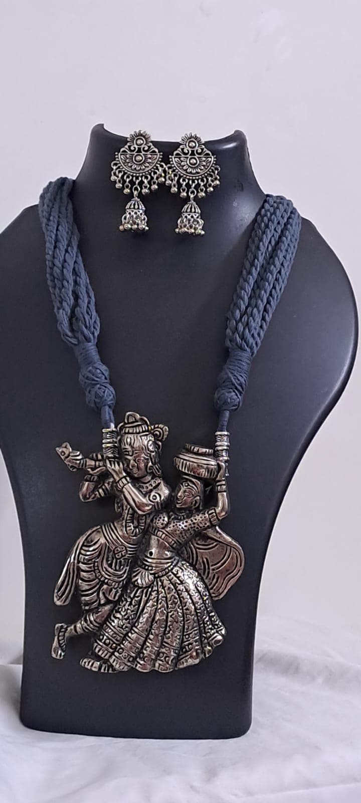Radha Krishna silver oxidised pendant necklace in grey thread with matching earrings