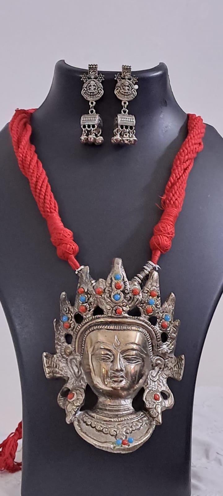 Maroon thread necklace with oxidised silver durga pendant