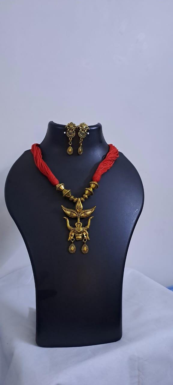 Red thread necklace with golden oxidised pendant