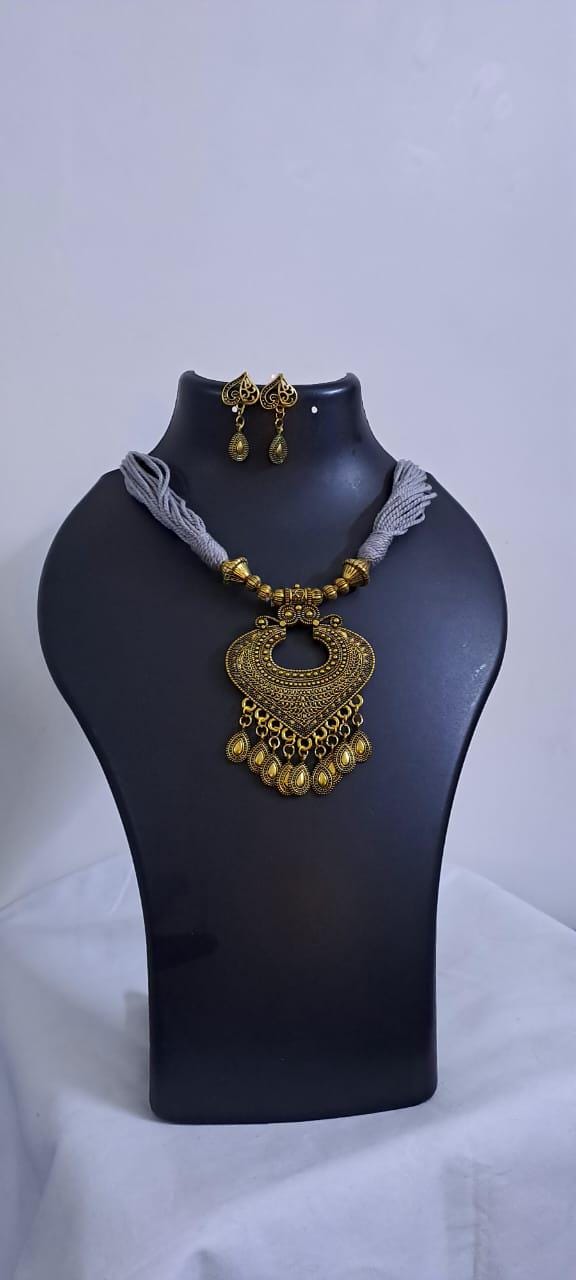 Grey thread necklace with Golden oxidised traditional pendant