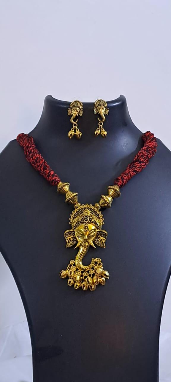 Red thread necklace with Golden oxidised traditional pendant