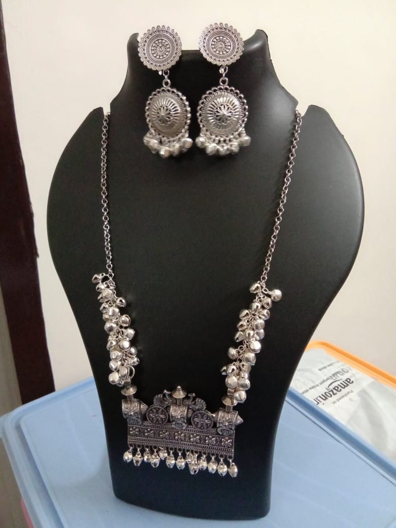 Oxidised silver chain with traditional pendant and matching earrings.