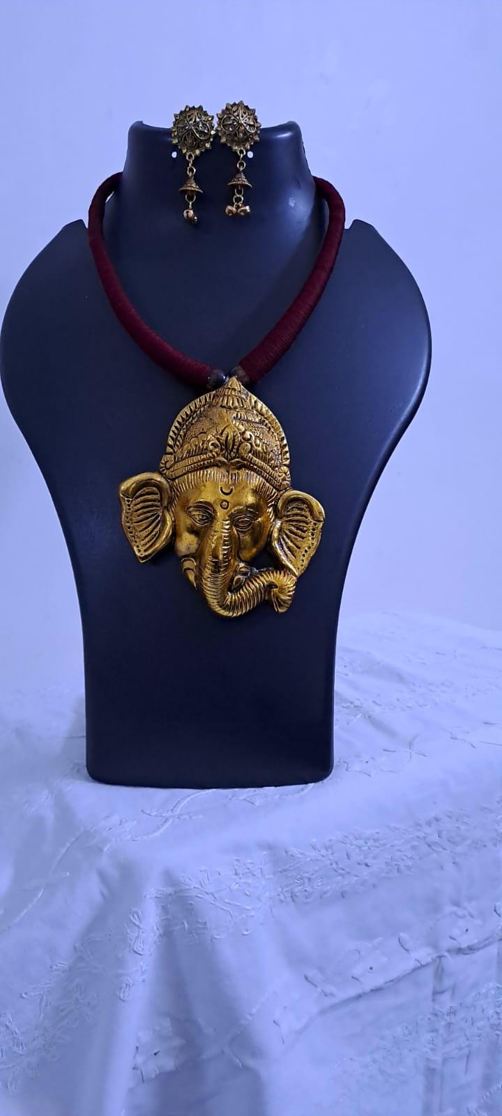 Maroon thread necklace with golden oxidised ganesha pendant