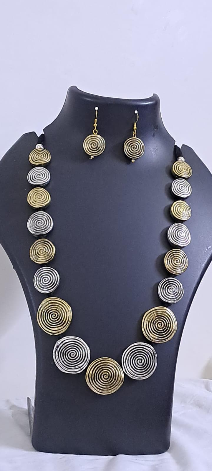 Exclusive silver oxidised set with flat round beads of gold n silver tone mix n matching earrings