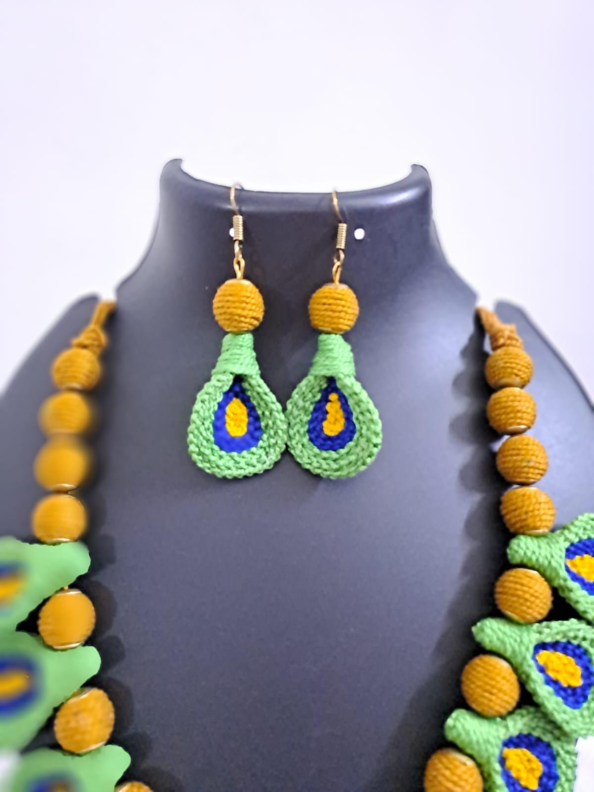 Green n yellow thread necklace with matching thread earrings.