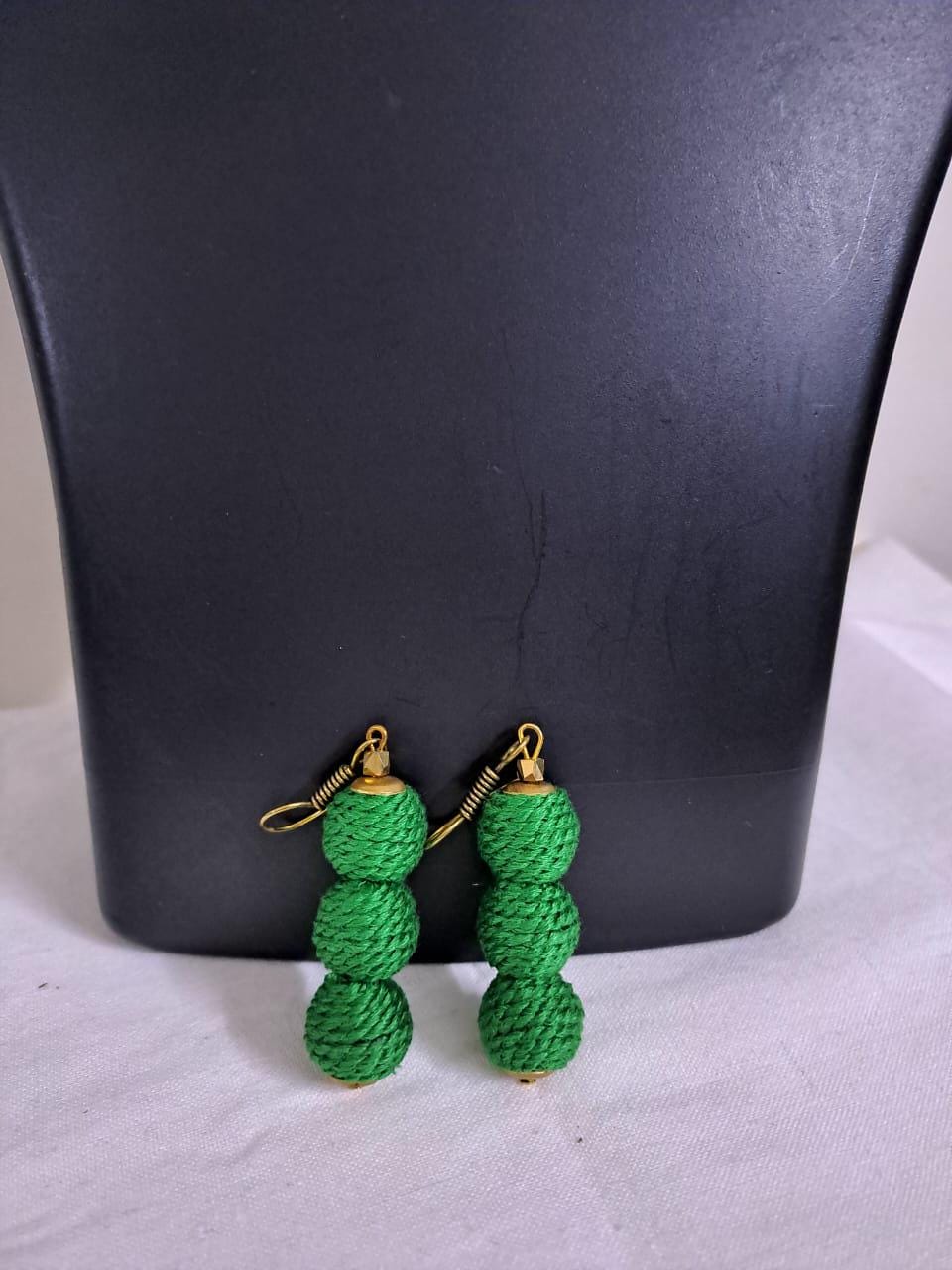 Green braided choker necklace set with fringes and matching earrings