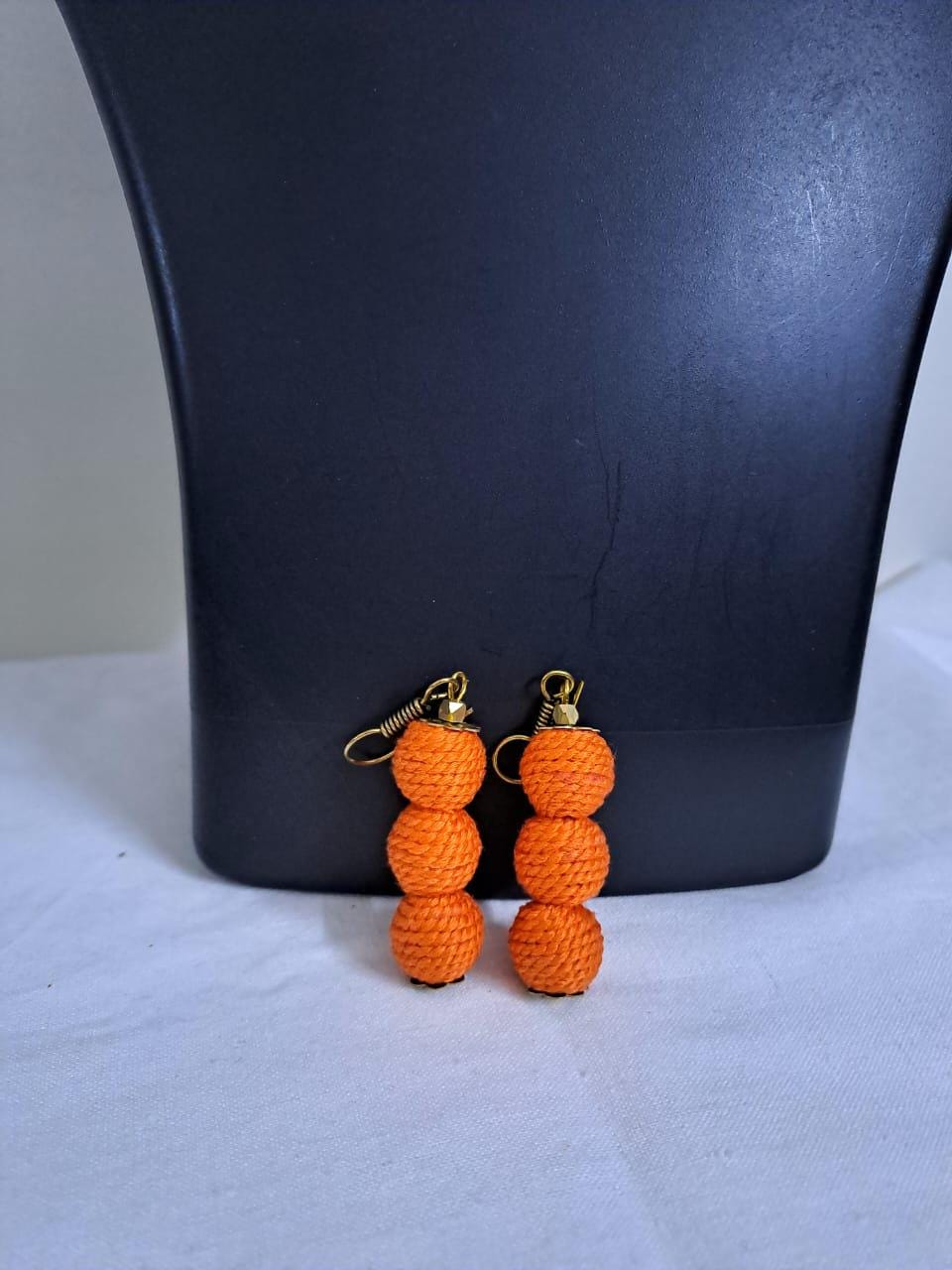 Orange braided choker necklace set with fringes and matching earrings