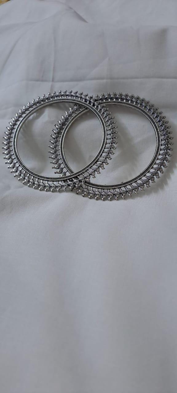 Traditional silver oxidised bangles with birds border.