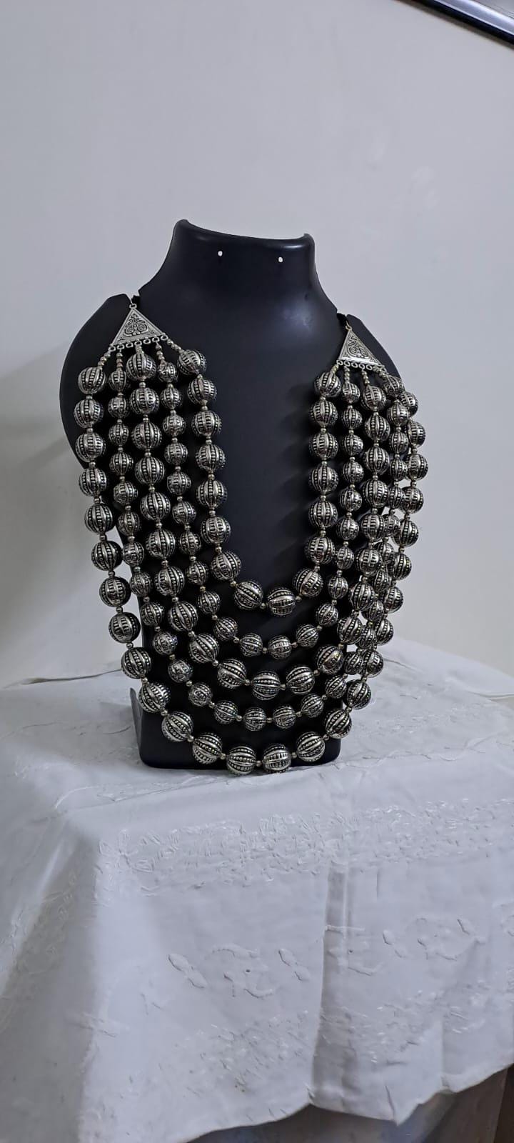 Multi-layered silver oxidised beads necklace .