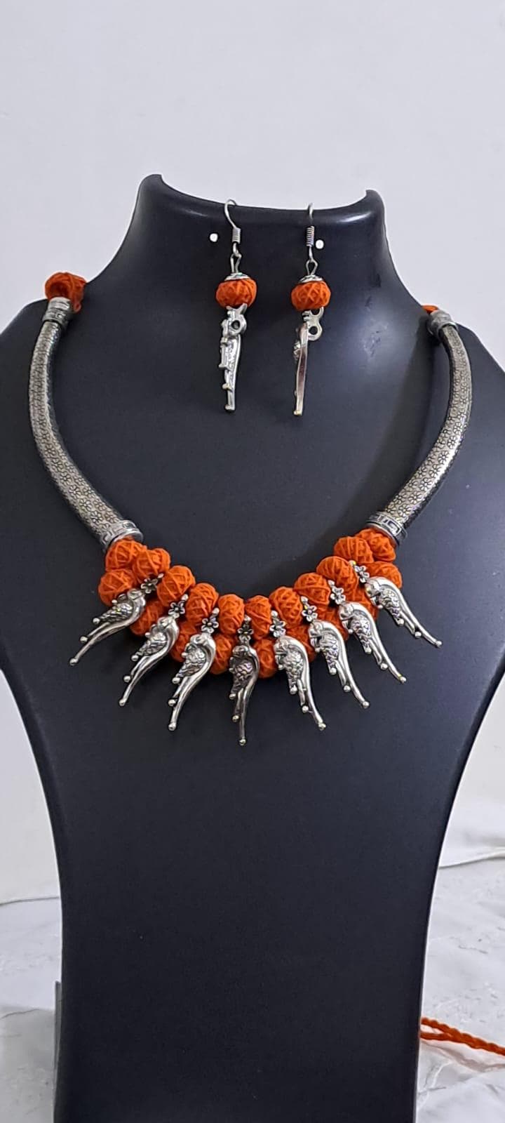 Orange thread necklace with kolhapuri silver oxidised traditional beads and matching earrings