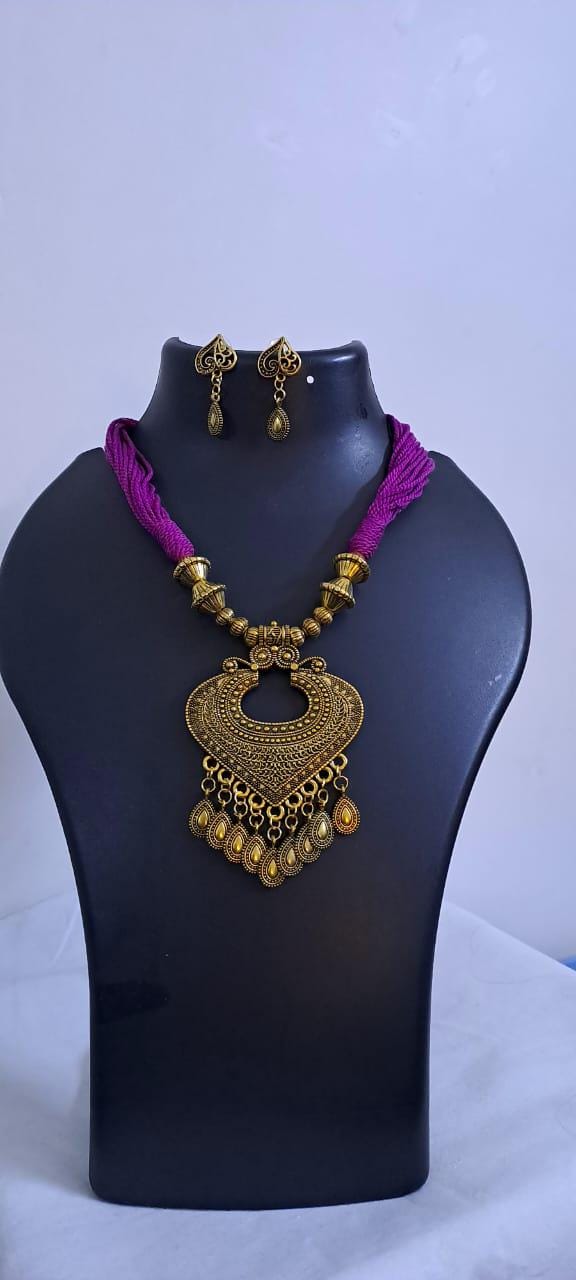 Purple thread necklace with Golden oxidised traditional pendant