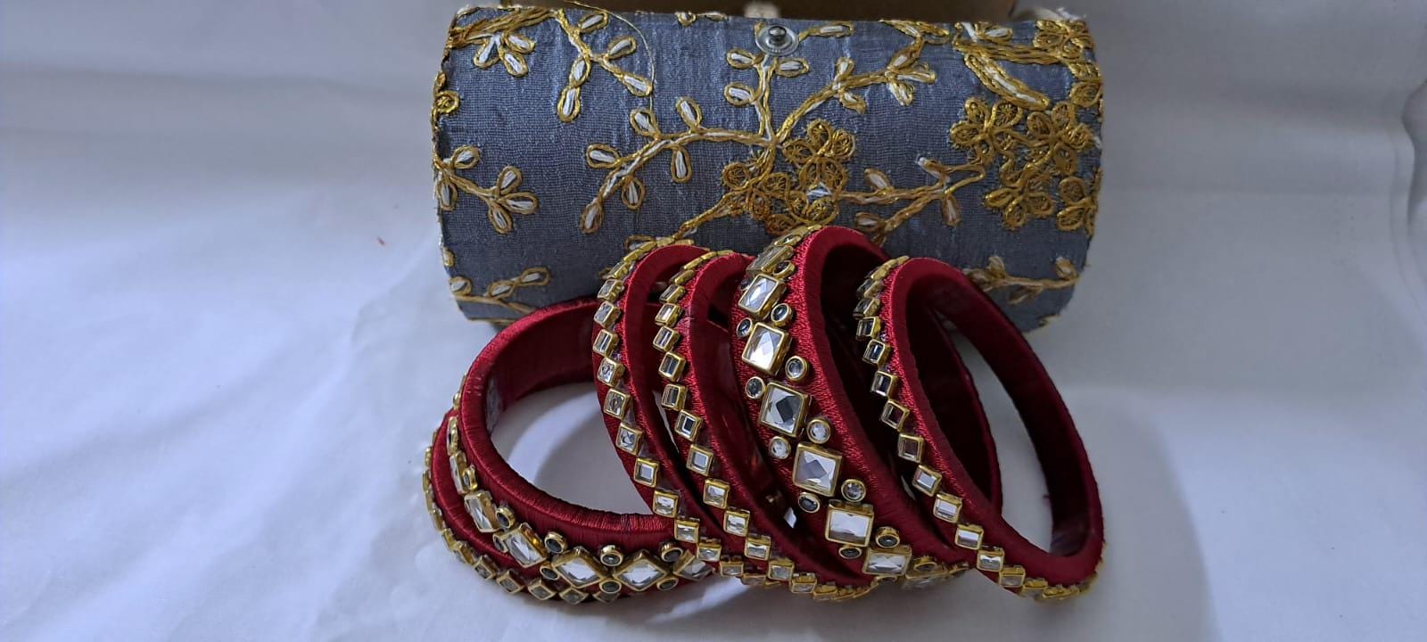 Maroon colour traditional thread kundan bangles with zari bangle box