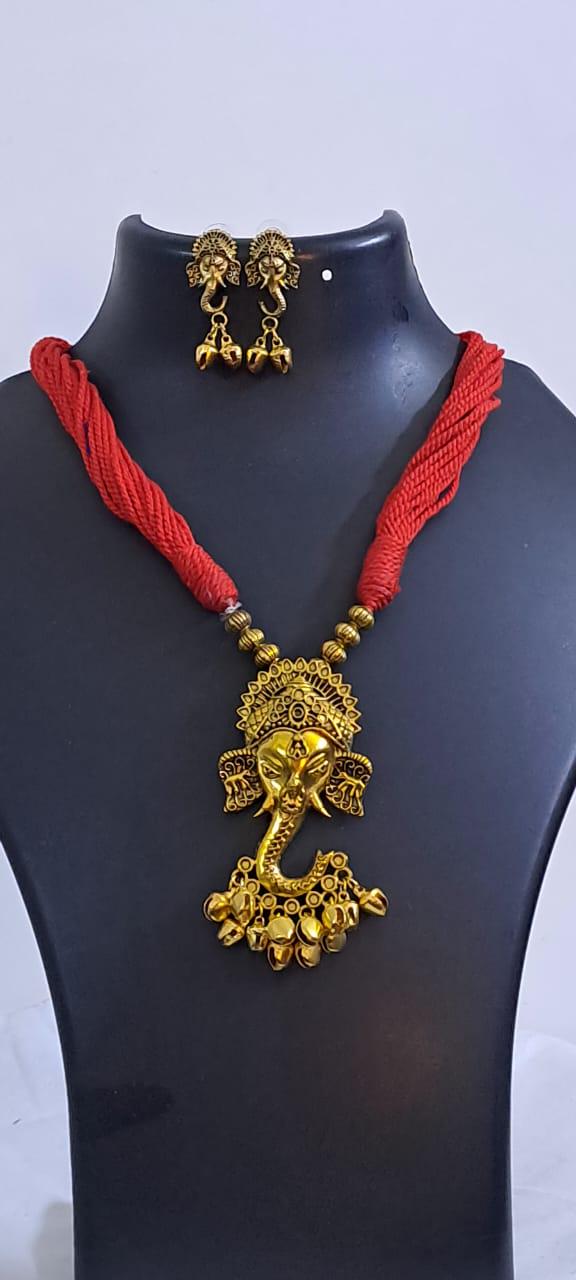 Red thread necklace with Golden oxidised traditional pendant