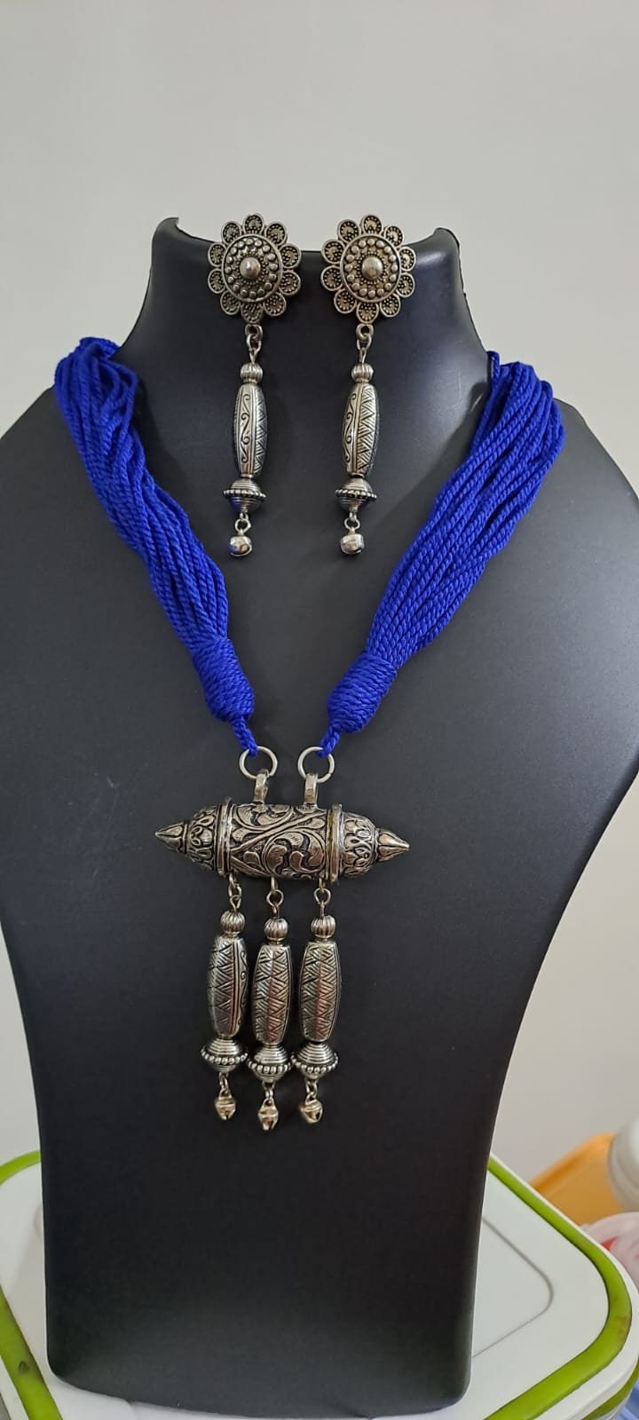 Blue thread necklace with silver oxidised traditional pendant