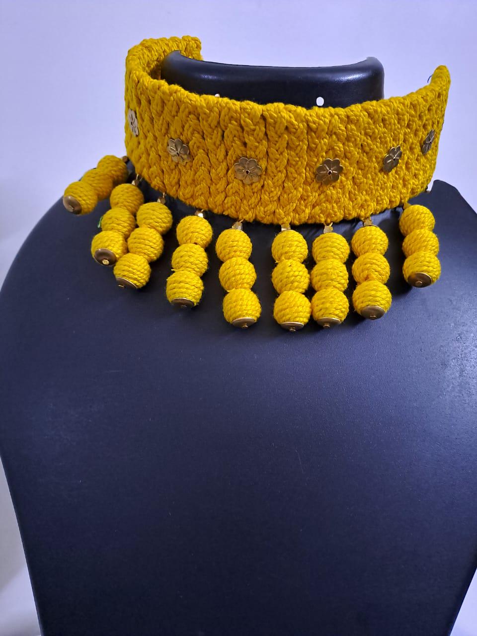 Yellow braided choker necklace set with fringes and matching earrings