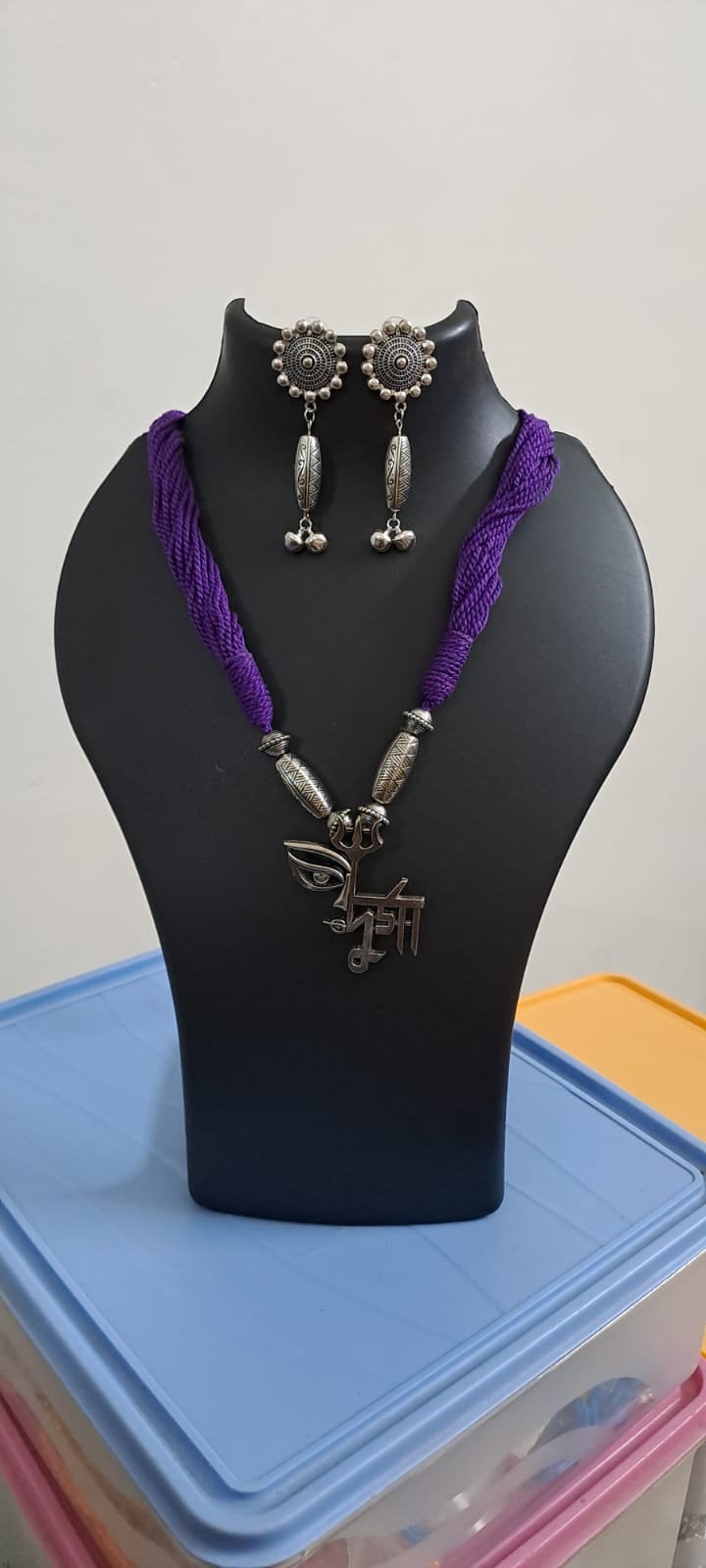 Purple thread necklace with oxidised silver durga pendant
