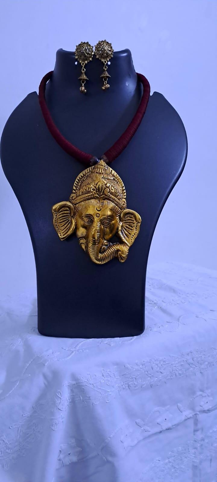 Maroon thread necklace with golden oxidised ganesha pendant