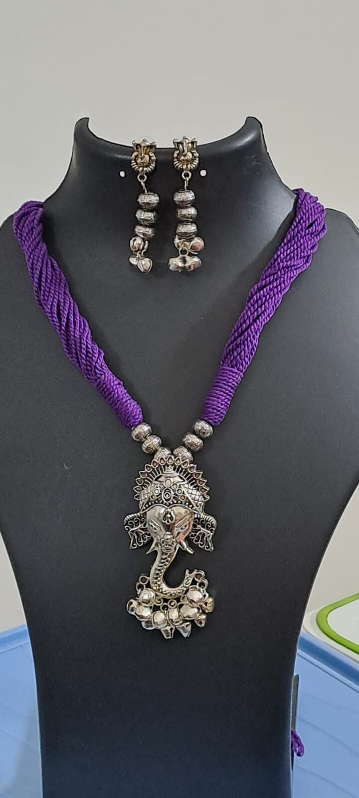 Purple thread necklace with oxidised silver ganesha pendant