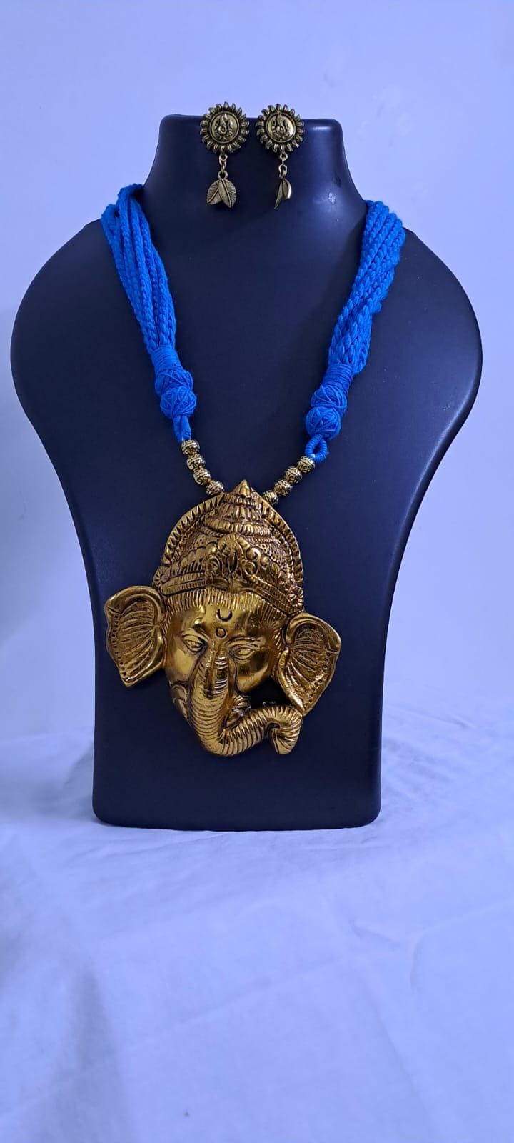 Blue thread necklace with golden oxidised ganesha pendant
