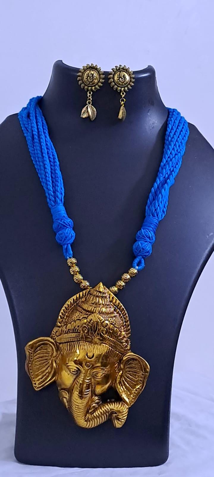 Blue thread necklace with golden oxidised ganesha pendant