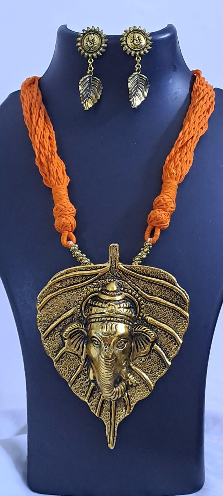 Orange thread necklace with golden oxidised ganesha pendant