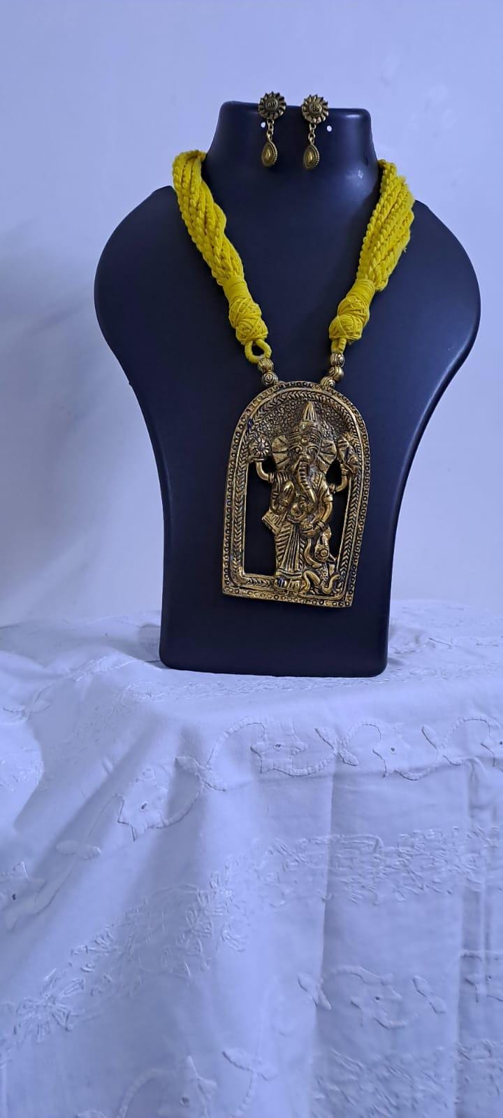 Yellow thread necklace with golden oxidised ganesha pendant