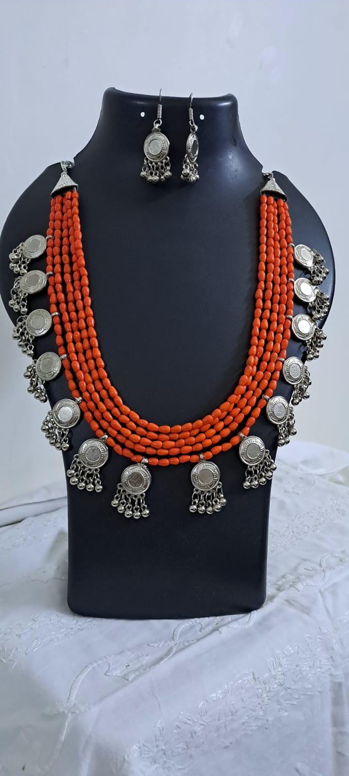 Exclusive multi layered  orange glass beads necklace set with silver oxidised charms n matching earrings