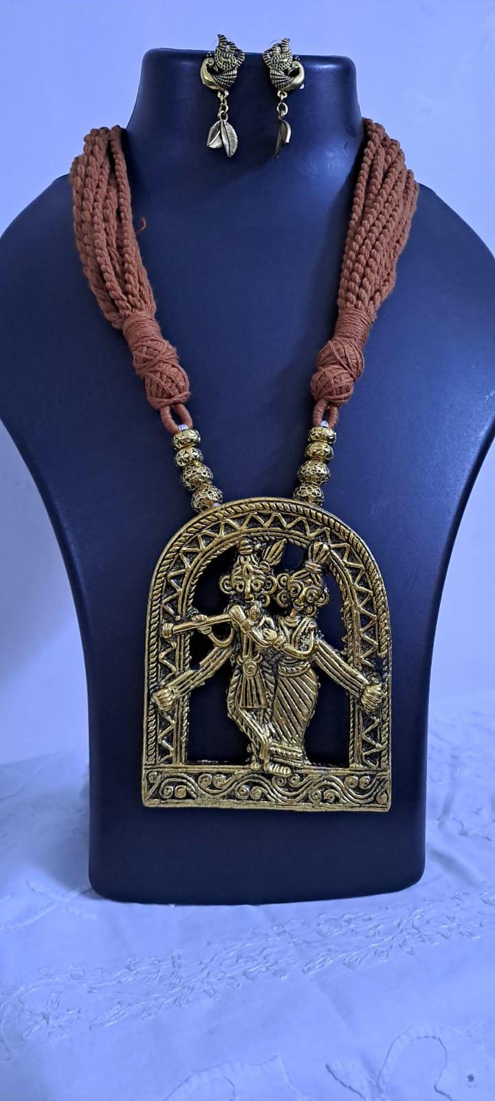 Radha Krishna golden oxidised pendant necklace in brown tread with matching earrings